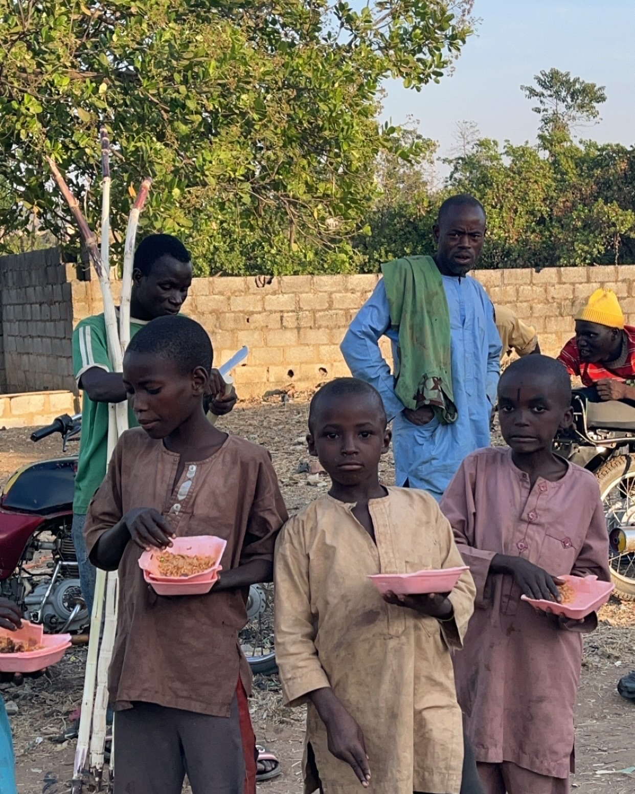 boys eating rice